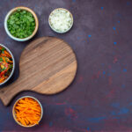 Home top view sliced vegetable salad inside plate with greens dark desk